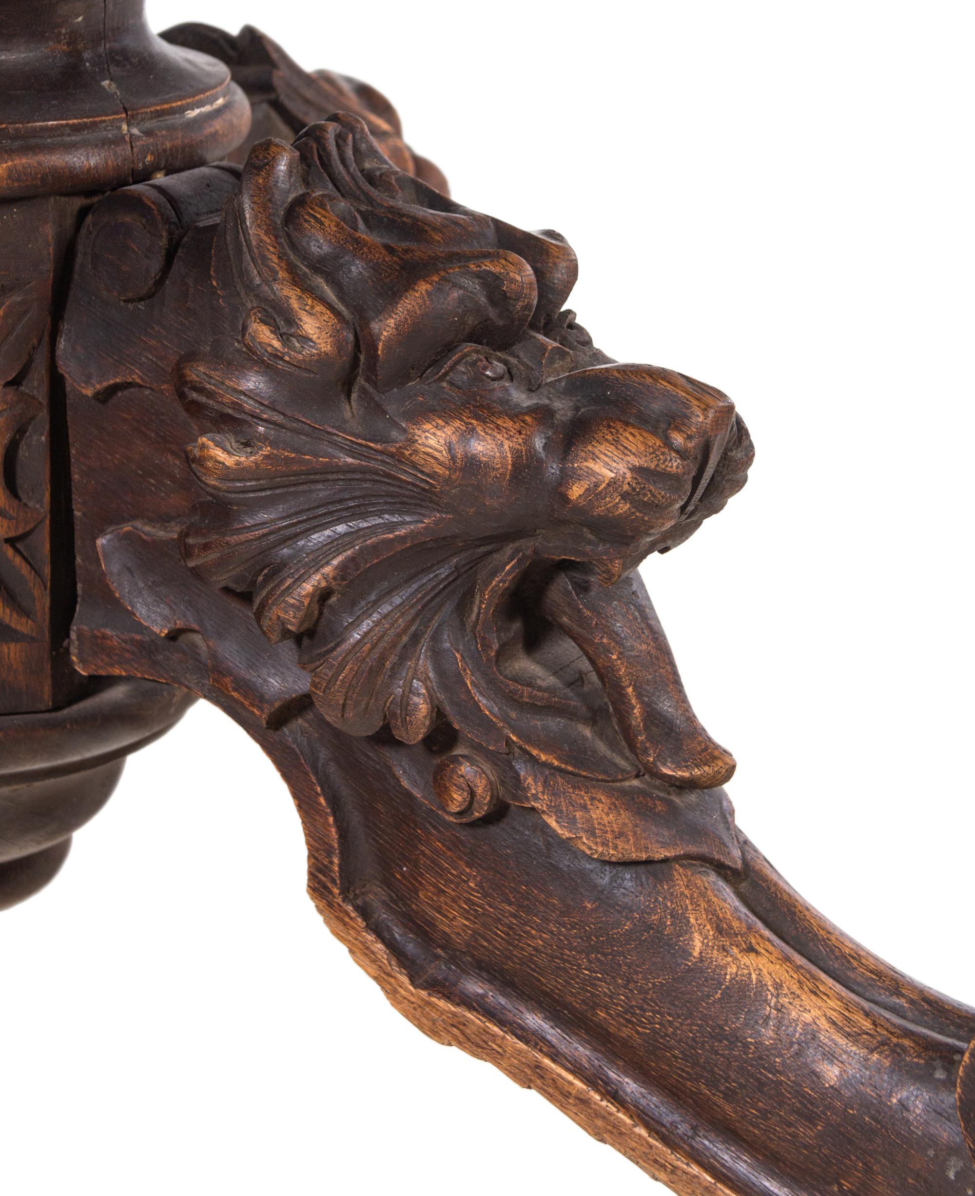 A Renaissance Revival Carved Walnut Breakfast Table and Chairs