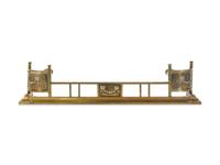A Continental Brass Fireplace Fender