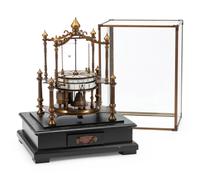 An Orbital Bronze and Enameled Mantel Clock with a Glass Dome