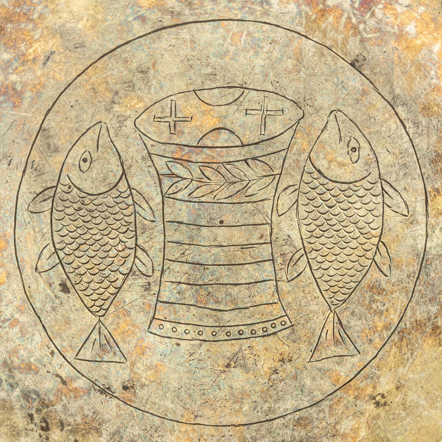 A Byzantine Gilt Silver Paten with Fish and Breadbasket