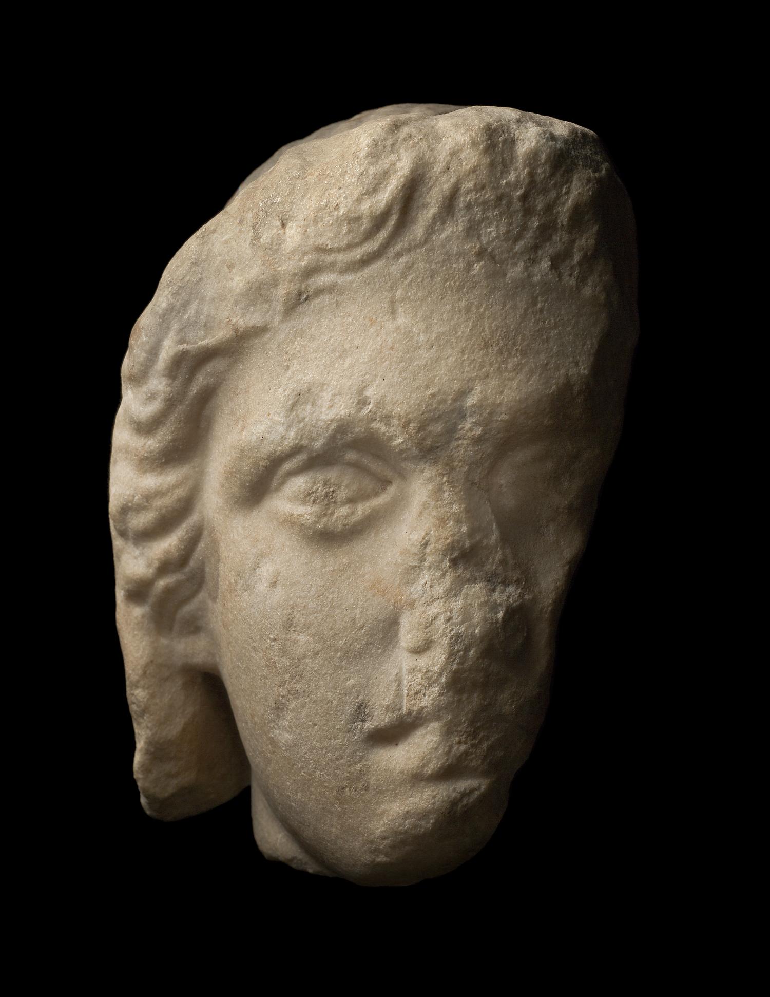 A Greek Fragmentary Marble Male Head