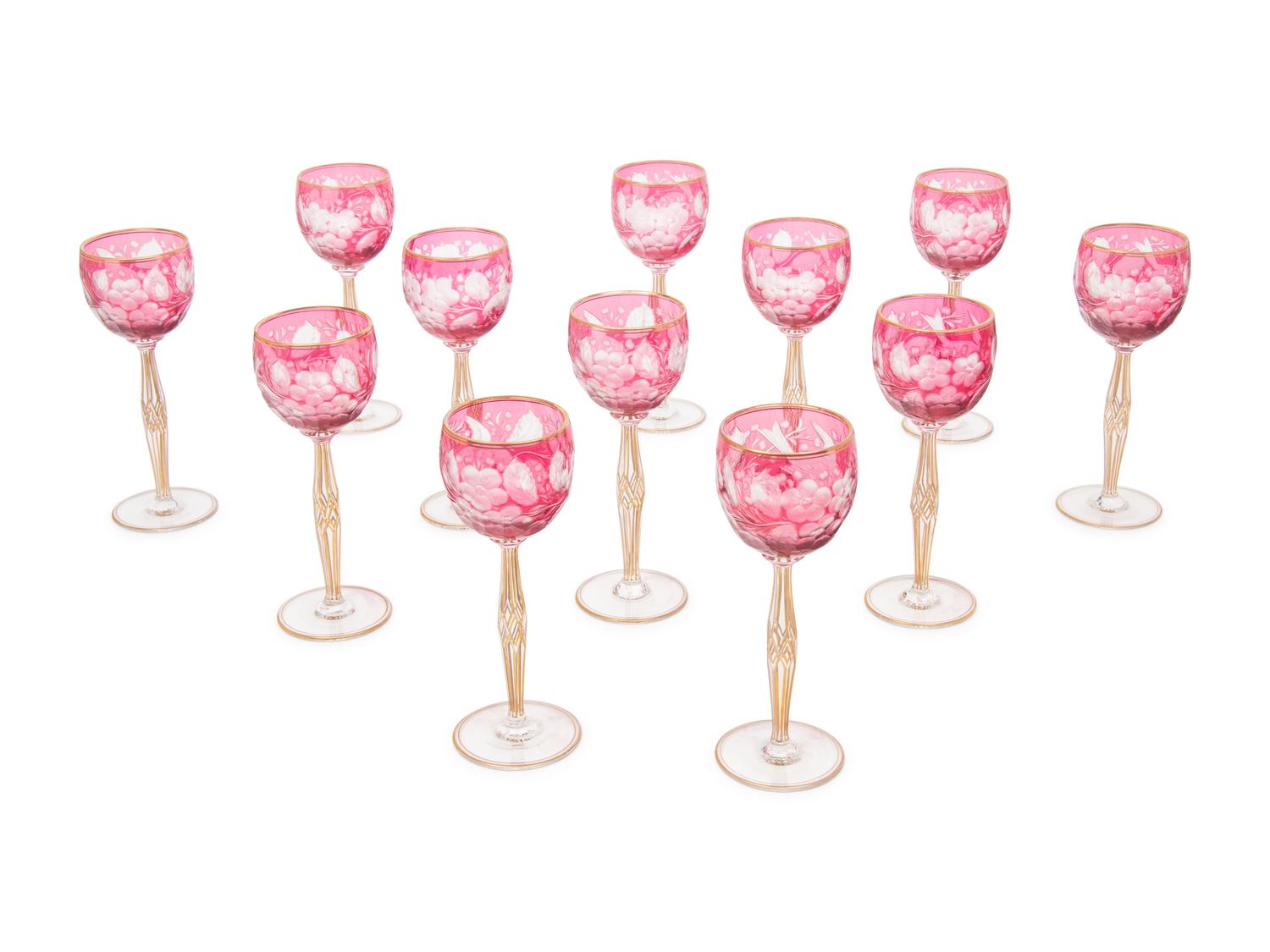 A Set of Twelve Bohemian Etched and Gilt Decorated Red Cut-to-Clear Wine Stems
