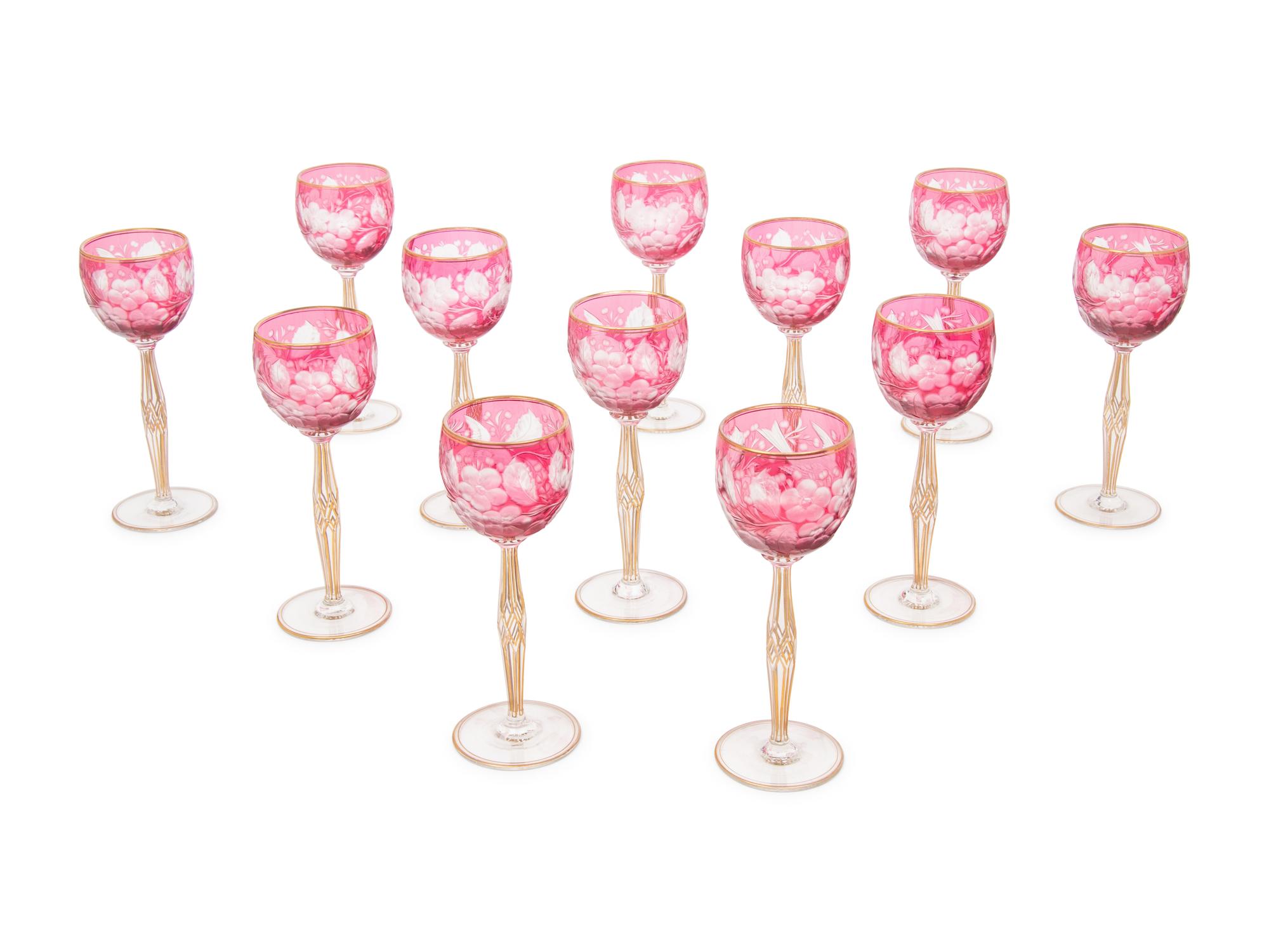 A Set of Twelve Bohemian Etched and Gilt Decorated Red Cut-to-Clear Wine Stems