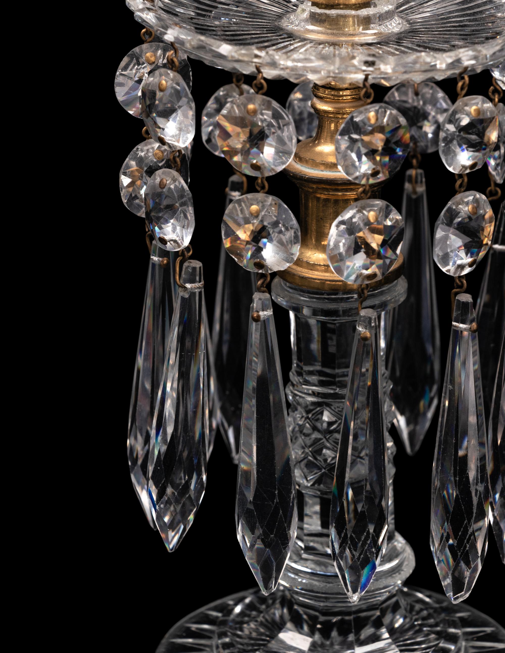 A Set of Four Regency Brass-Mounted Cut Glass Candlesticks