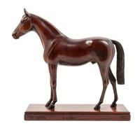 A Carved Wood Figure of a Thoroughbred Horse Height 11 3/4 inches. — PETER GIBA, 1944