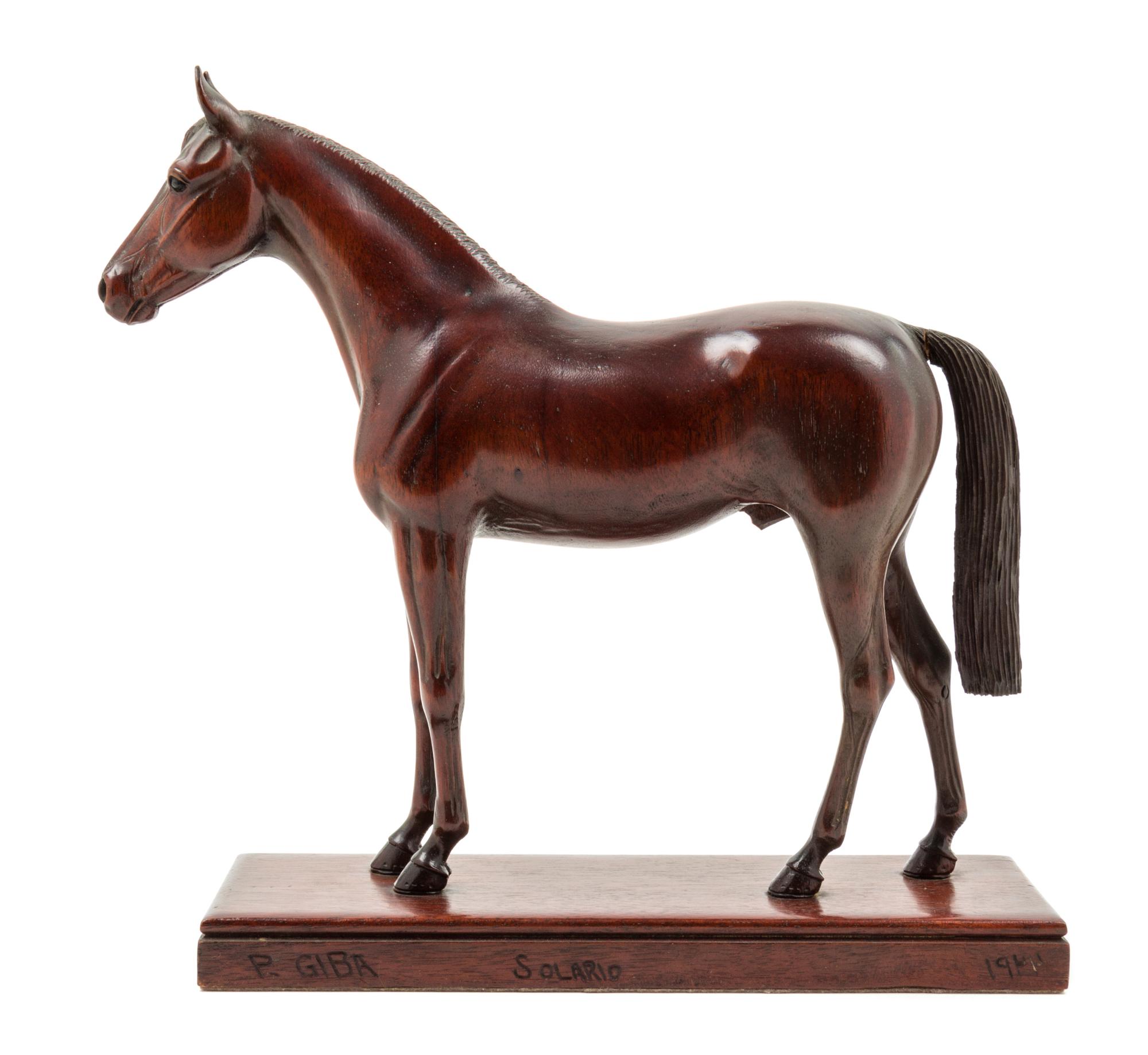 A Carved Wood Figure of a Thoroughbred Horse Height 11 3/4 inches. — PETER GIBA, 1944