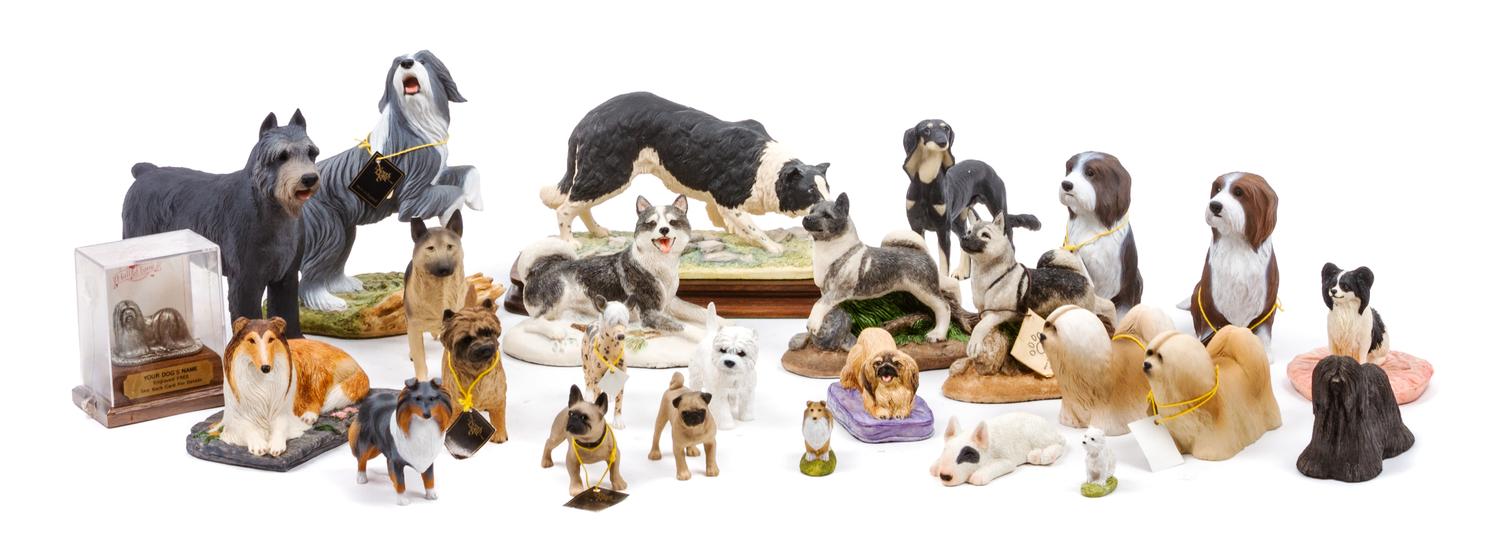 A Group of Twenty-Six Dog Figures of Various Breeds Width of widest 9 inches.