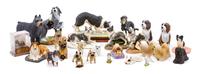 A Group of Twenty-Six Dog Figures of Various Breeds Width of widest 9 inches.
