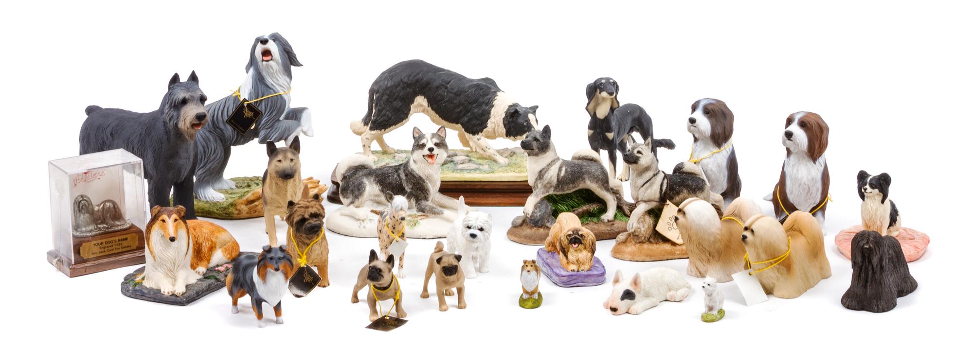 A Group of Twenty-Six Dog Figures of Various Breeds Width of widest 9 inches.