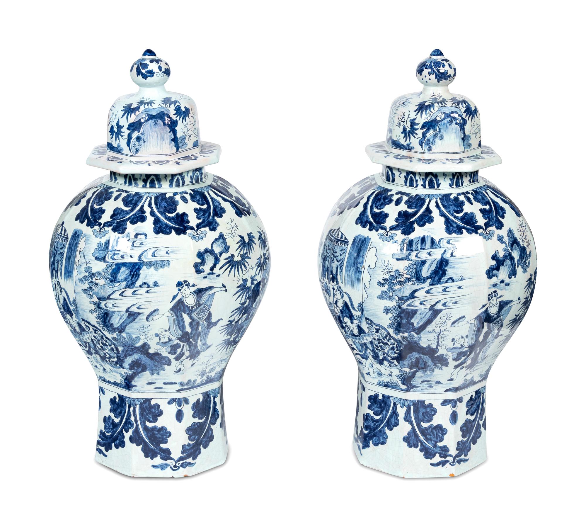 A Pair of Delftware Vases and Covers