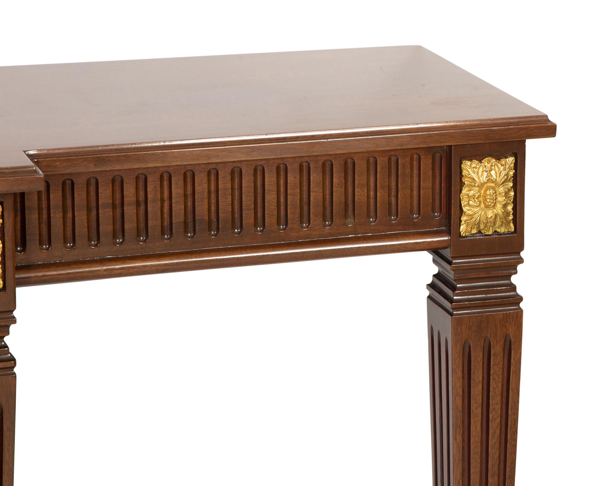 A Louis XVI Style Parcel Gilt Mahogany Console Table