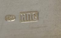 A Russian Silver Cigarette Case, Mark of Ivan Petrovich Speshnev, Moscow, Late 19th Century, the lid worked to show floral sprays and a