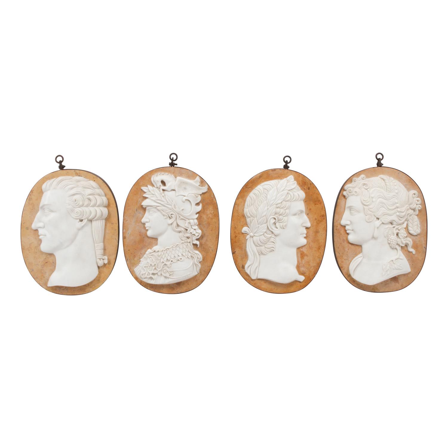 A Set of Four Carved Marble and Iron Mounted Profile Plaques