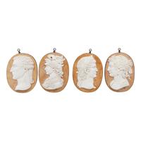 A Set of Four Carved Marble and Iron Mounted Profile Plaques