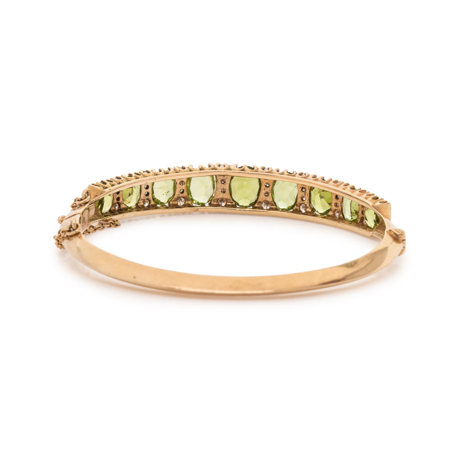 YELLOW GOLD, PERIDOT AND DIAMOND BANGLE BRACELET