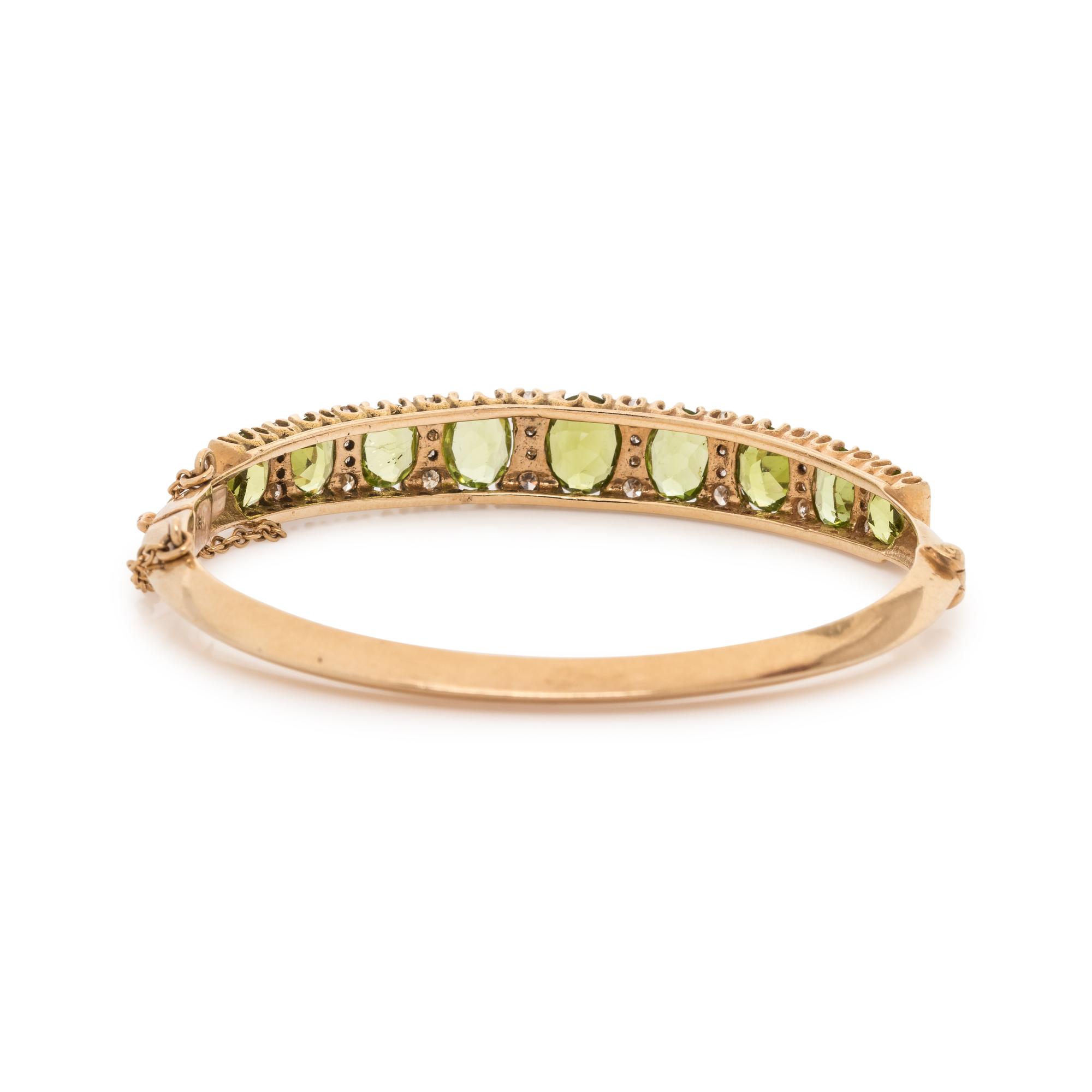 YELLOW GOLD, PERIDOT AND DIAMOND BANGLE BRACELET