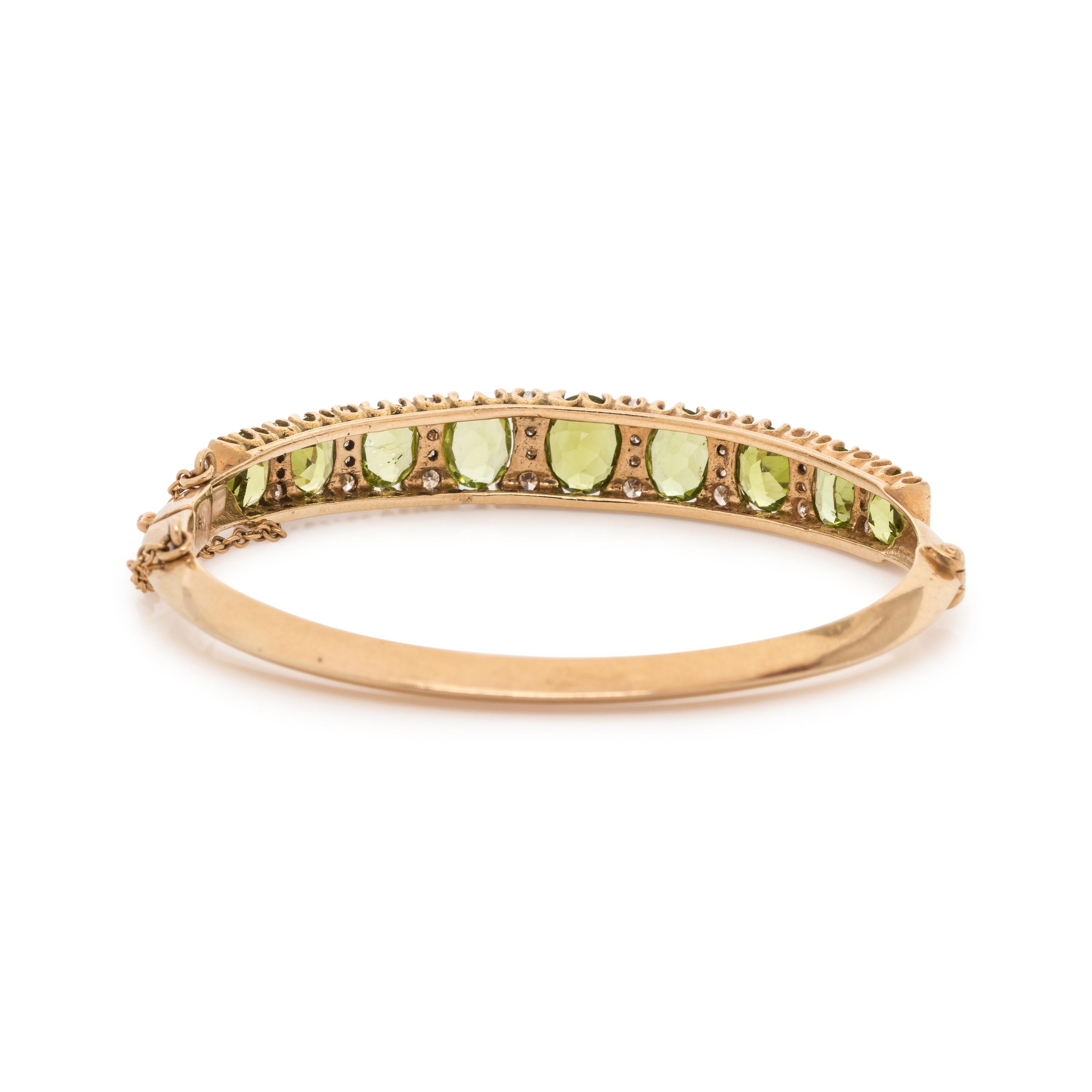 YELLOW GOLD, PERIDOT AND DIAMOND BANGLE BRACELET