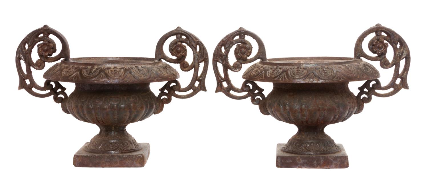 A Pair of Victorian Style Cast Iron Urns Width over handles 17 inches.