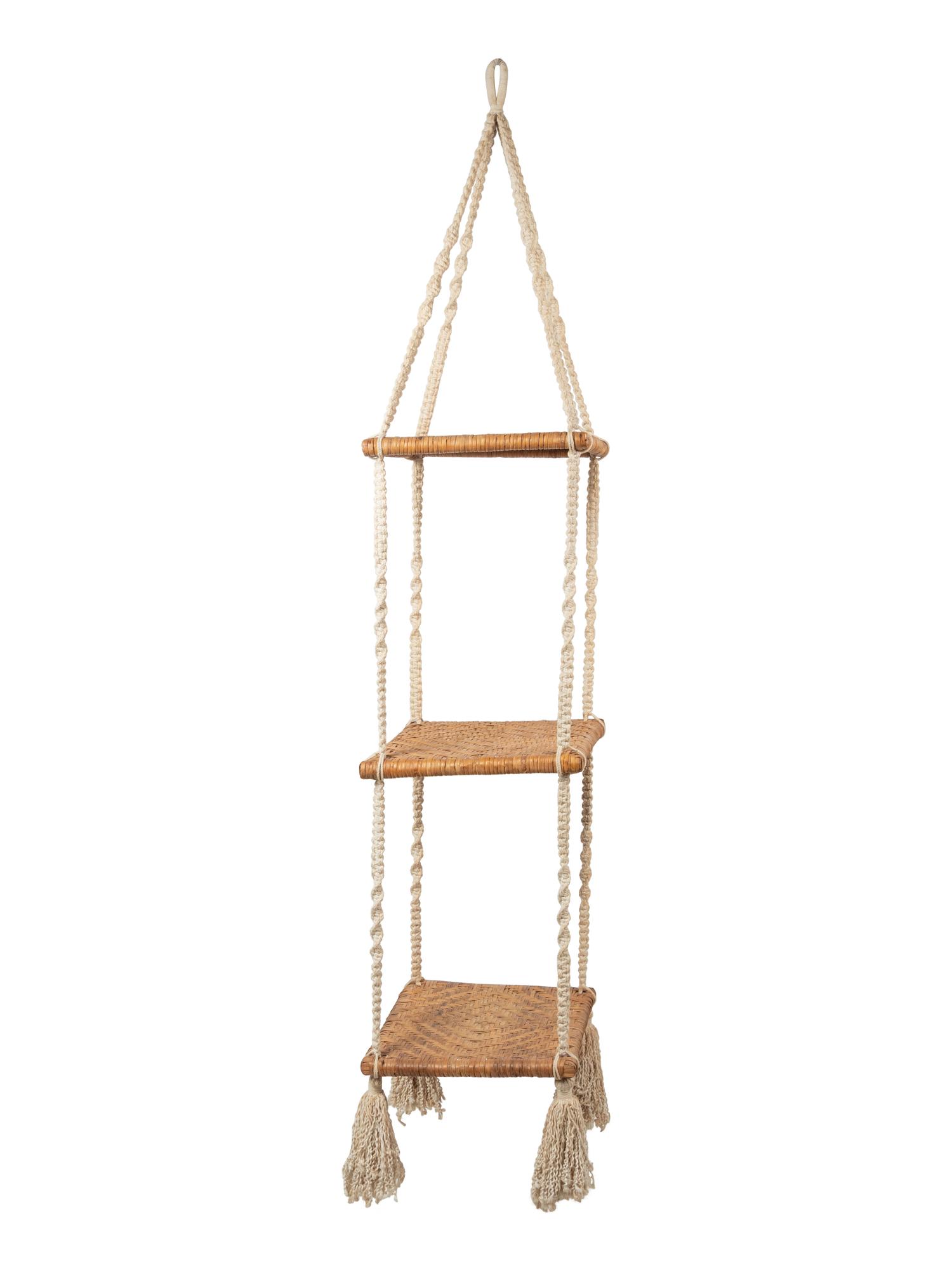 A Three-Tier Cord and Rattan Hanging Shelf Unit