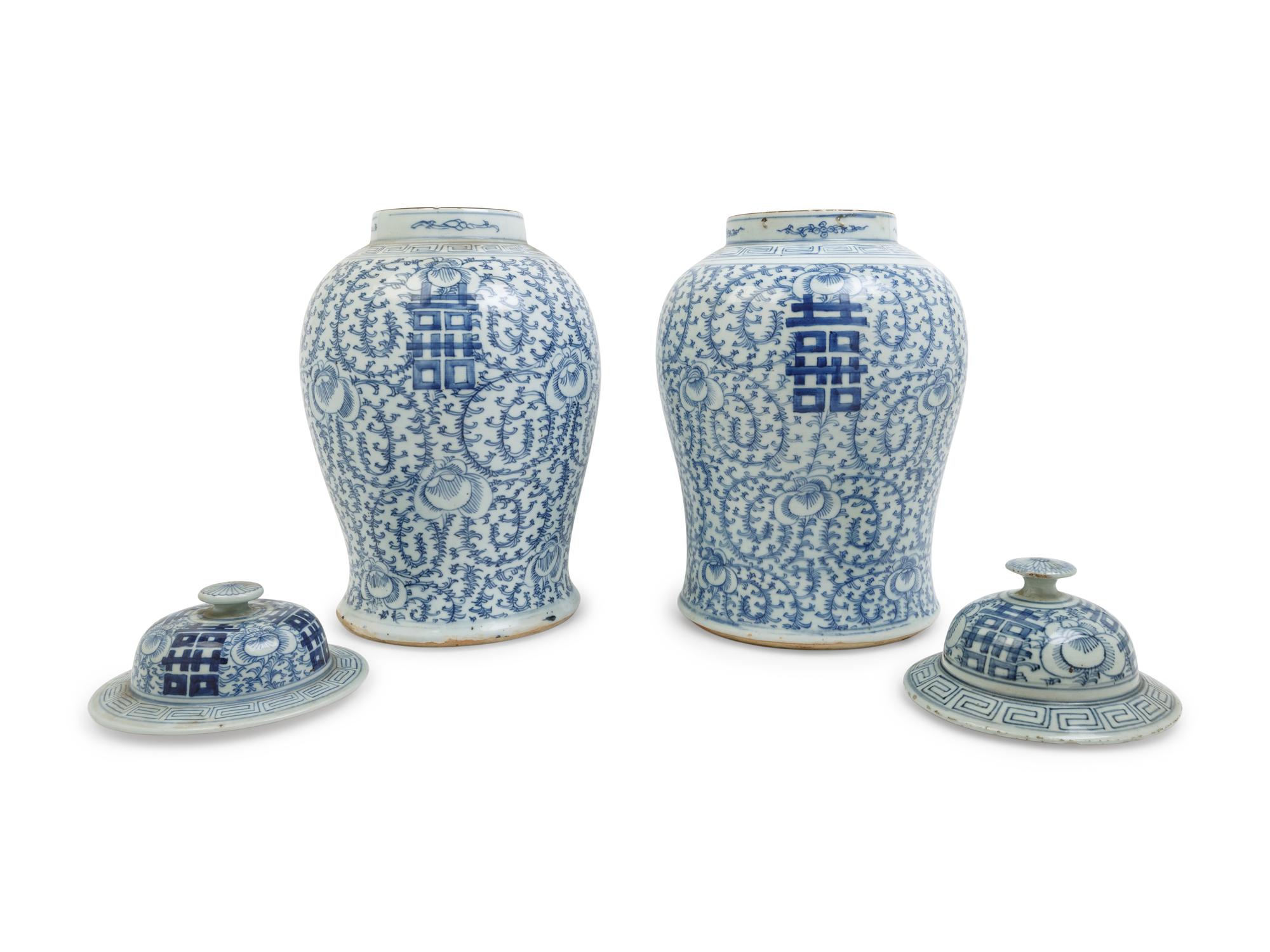 A Pair of Chinese Blue and White Porcelain Jars and Covers