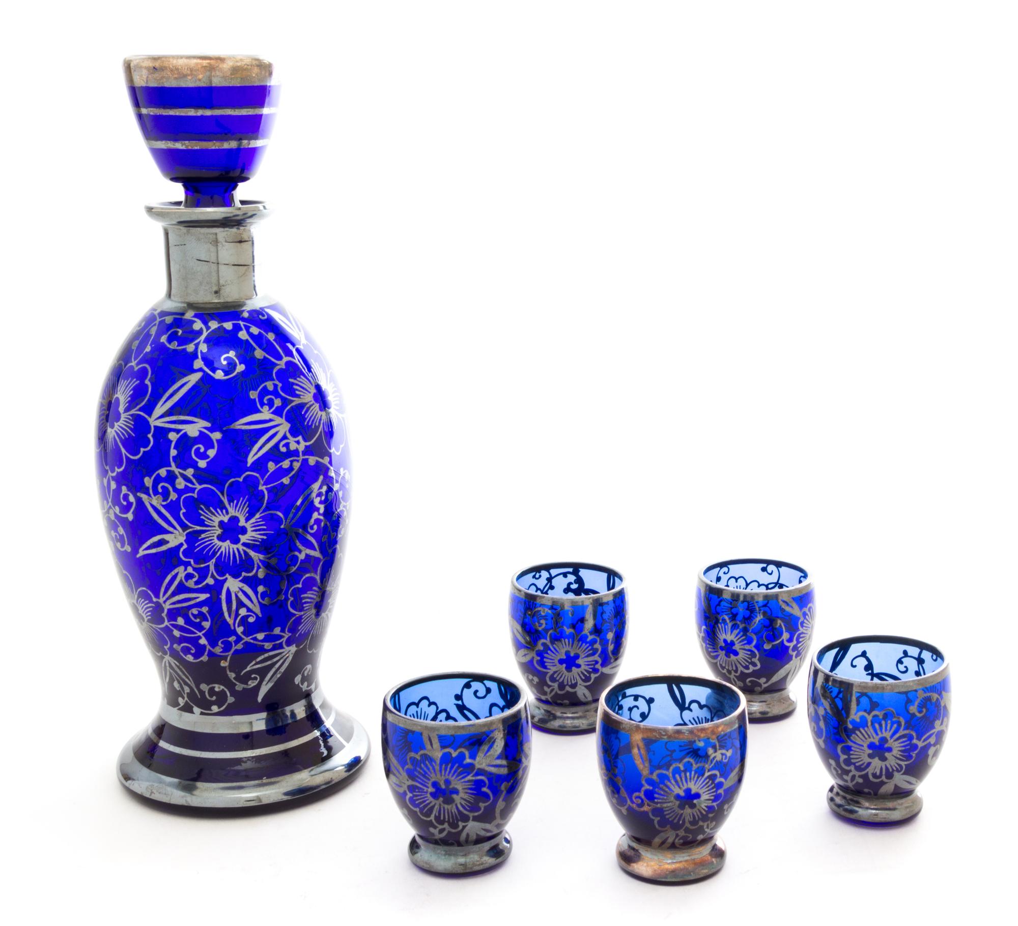 An Italian Silver-Overlay Glass Bottle Height 9 3/4 inches.