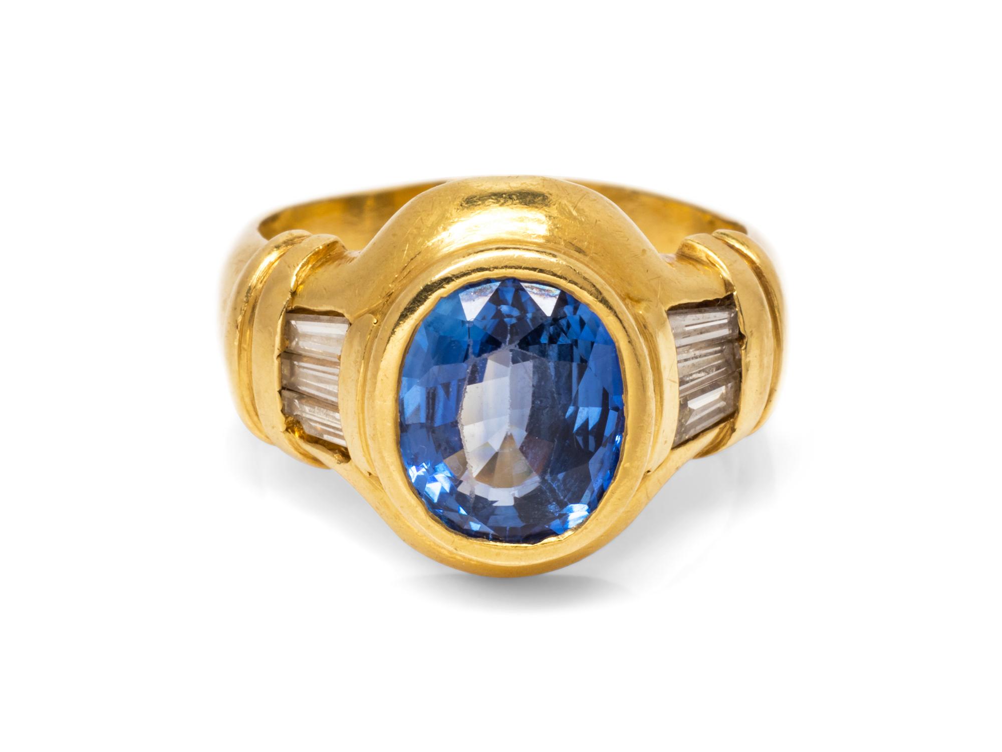 An 18 Karat Yellow Gold Sapphire and Diamond Ring,