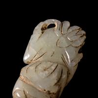 A Small Chinese Celadon Jade Figure of a Boy
