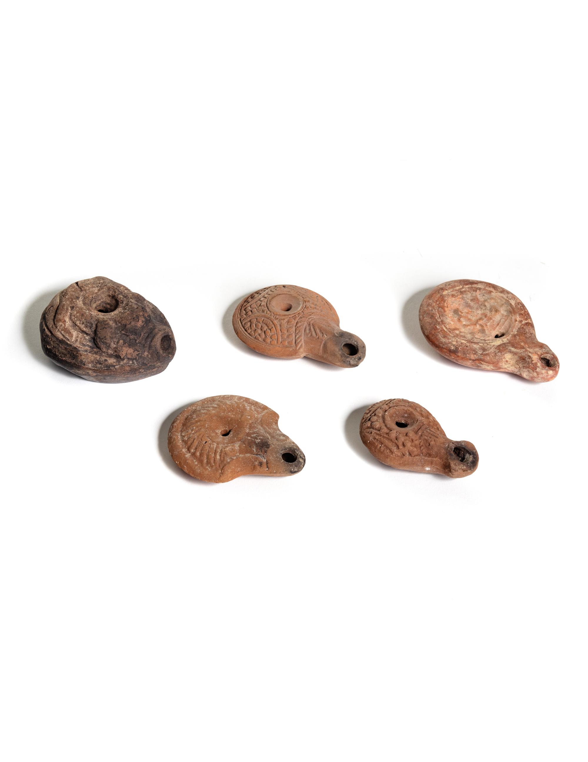 Five Roman Molded Terra Cotta Oil Lamps