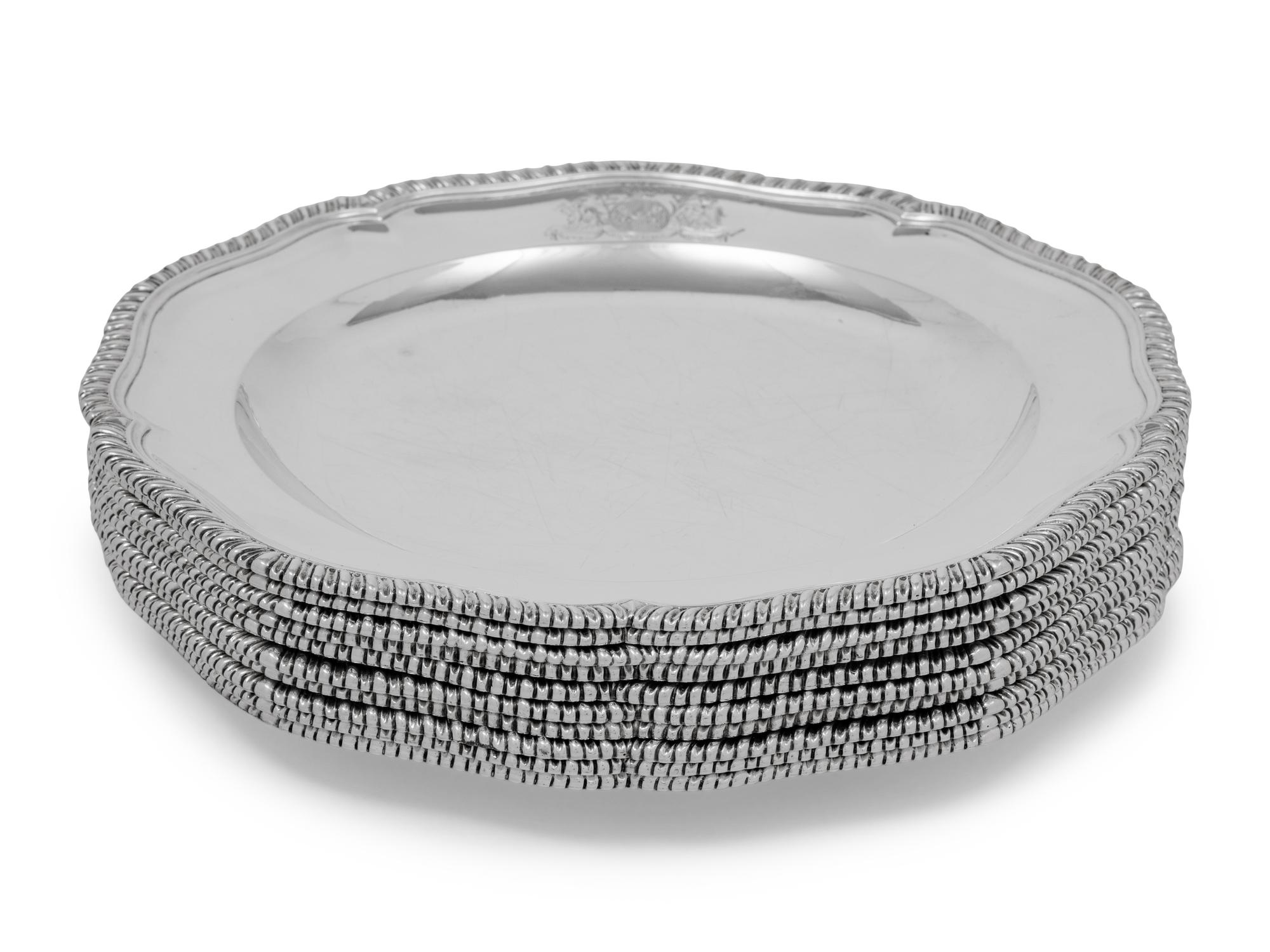 A Set of Ten George III Silver Dinner Plates
