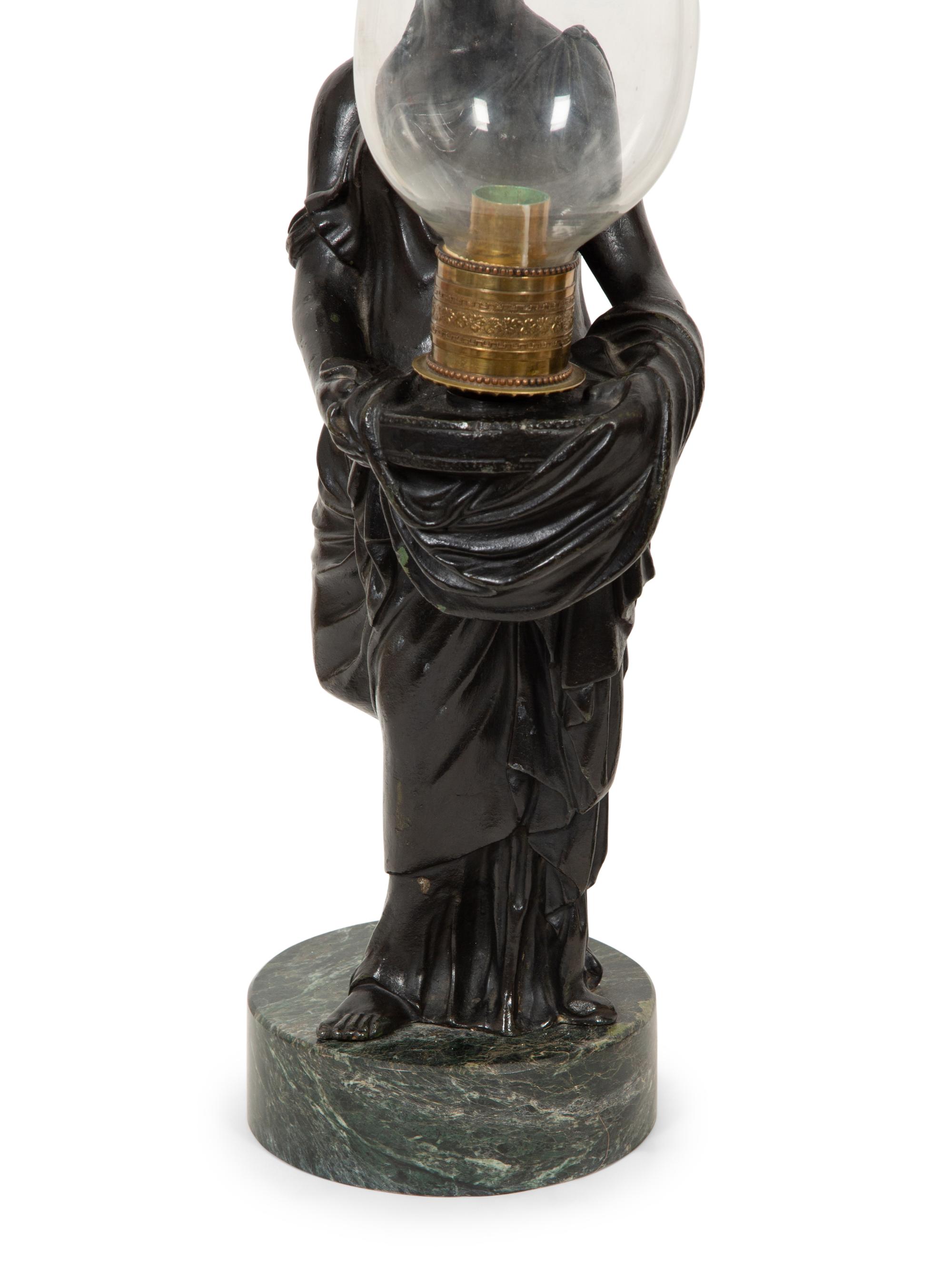 A Pair of Figural Hurricane Candlesticks on Verde Antico Marble Bases