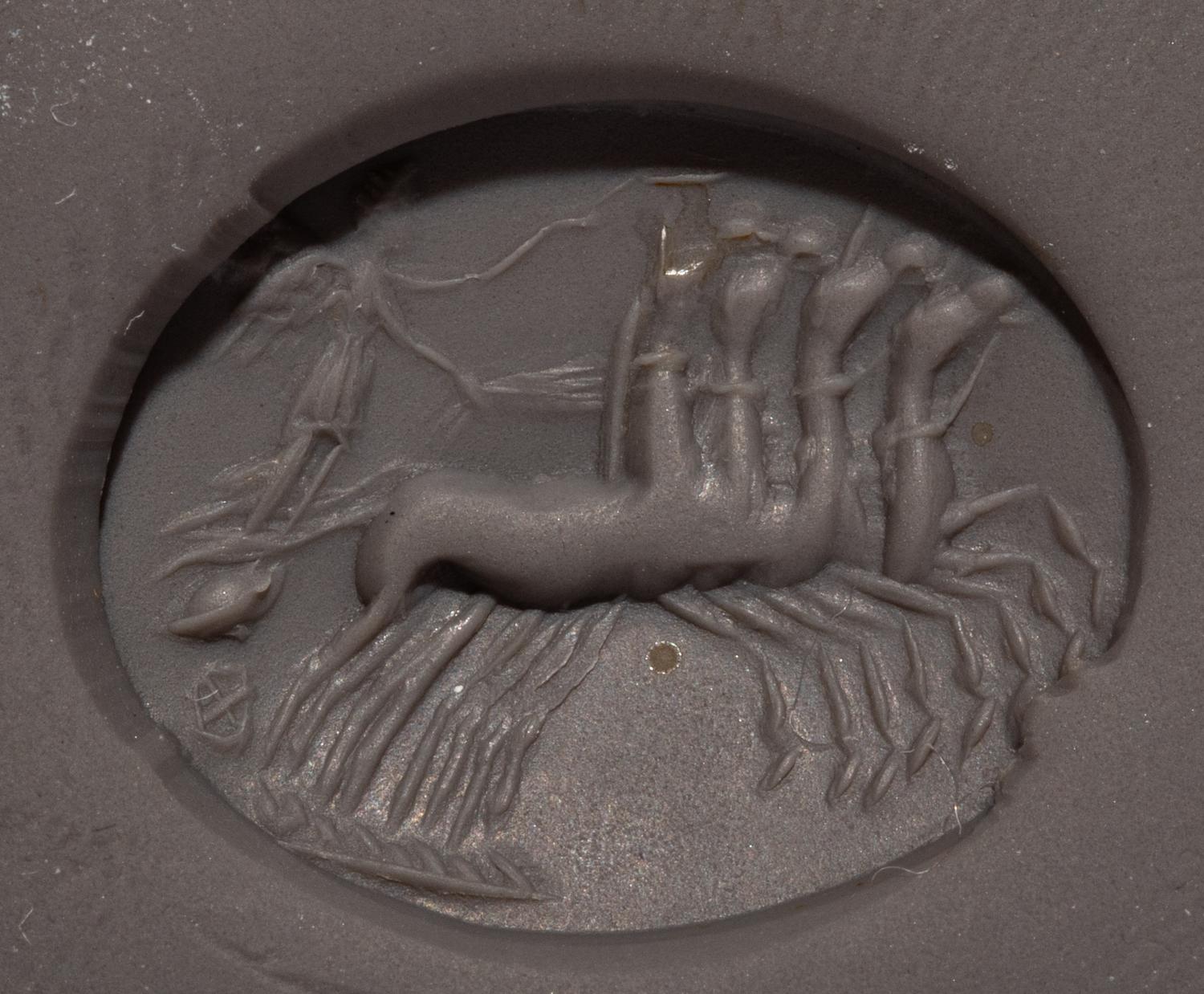 A Roman Carnelian Ring Stone with Nike Driving a Quadriga