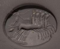 A Roman Carnelian Ring Stone with Nike Driving a Quadriga