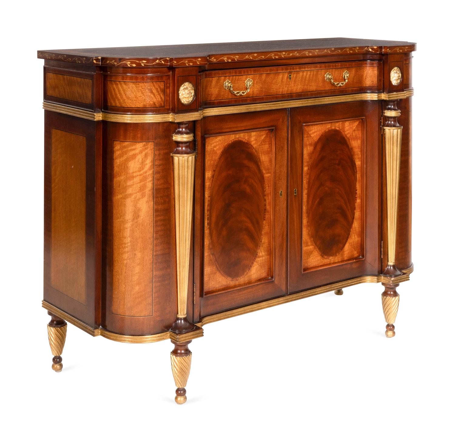 A Pair of E.J. Victor Regency Style Parcel Gilt Mahogany Sideboards