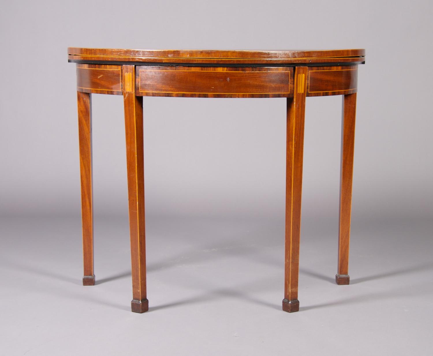A George III Mahogany and Inlaid Games Table, Height 29 1/8 x width 36 x depth 17 3/4 inches closed.