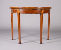 A George III Mahogany and Inlaid Games Table, Height 29 1/8 x width 36 x depth 17 3/4 inches closed.