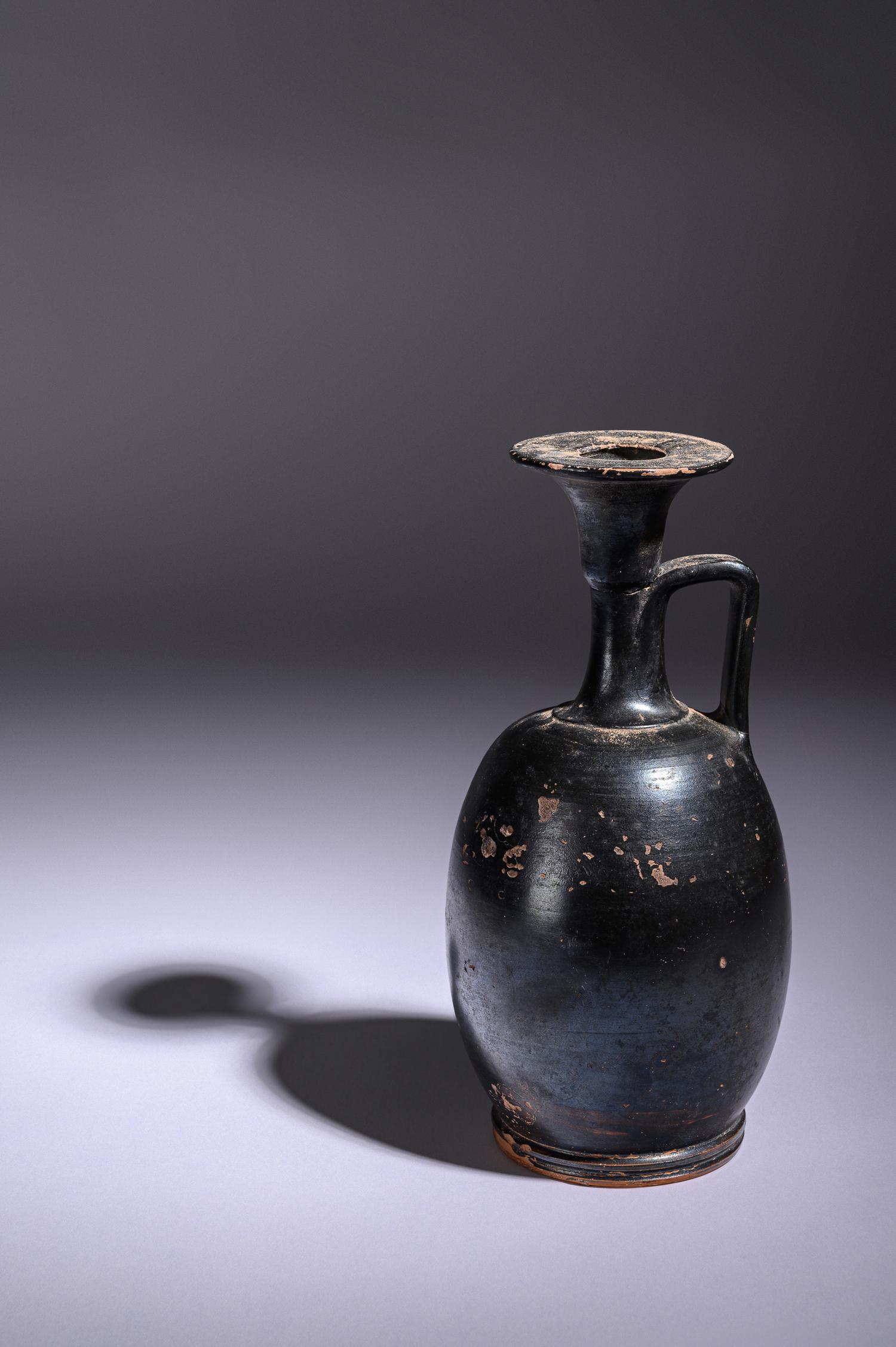 A Greek Black Glazed Lekythos