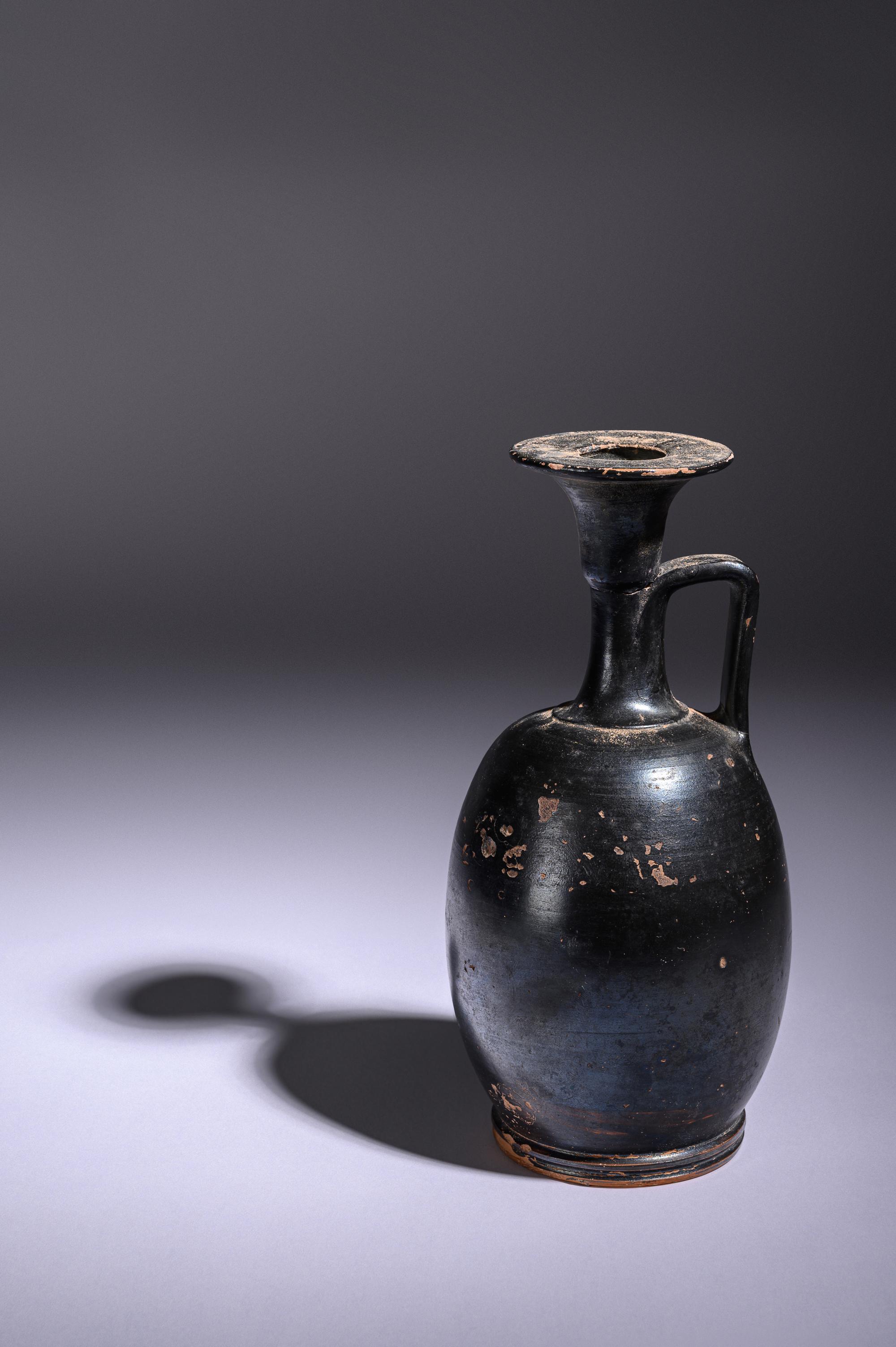 A Greek Black Glazed Lekythos