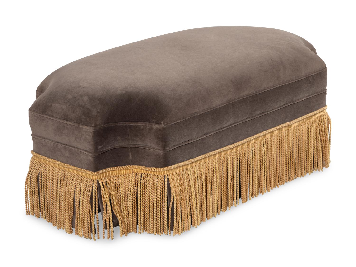 A Contemporary Velvet Upholstered Ottoman with Boullion Fringe