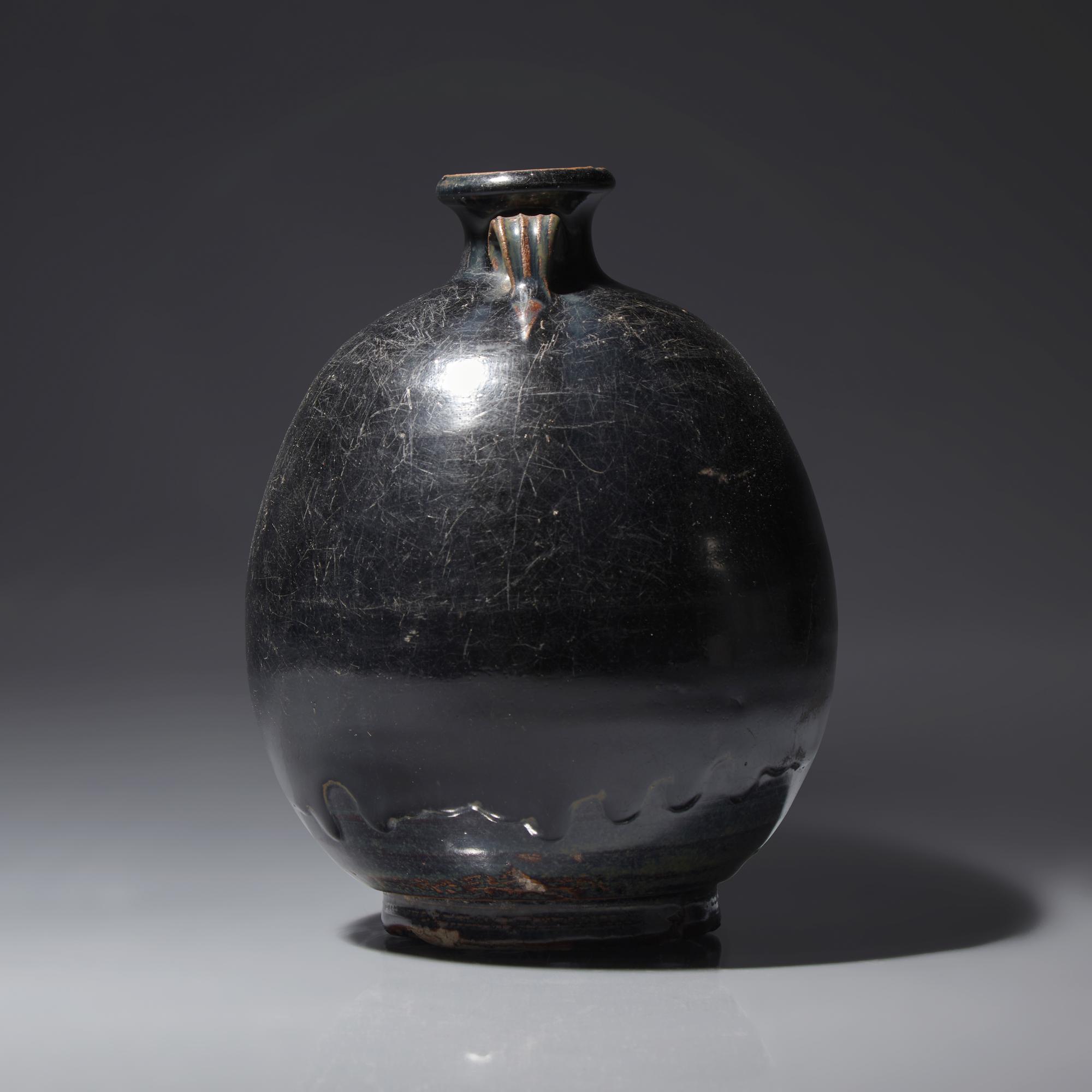 A Chinese Black Glazed Ovoid Jar, Jin/Yuan Dynasty — 金/元 黑釉雙耳罐