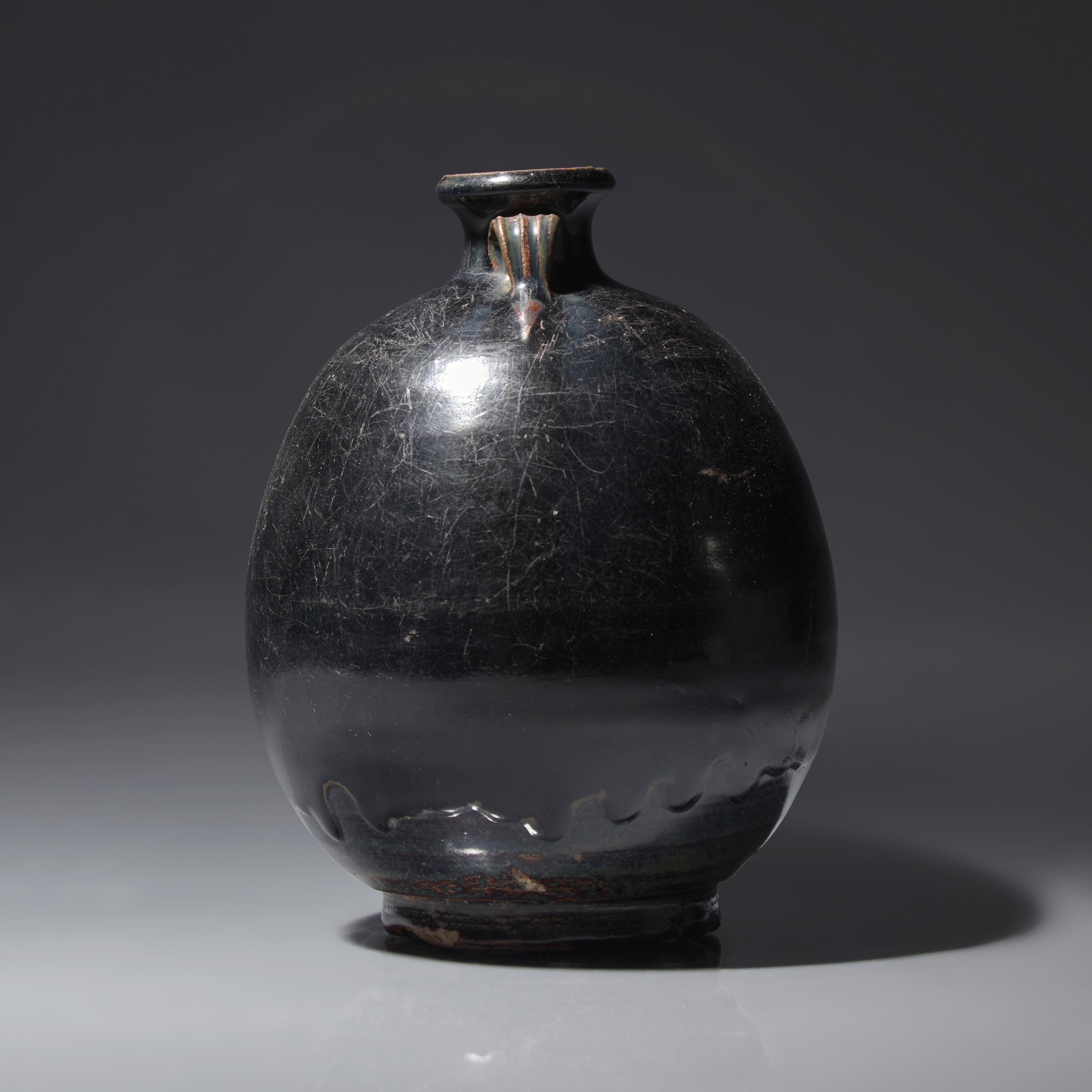 A Chinese Black Glazed Ovoid Jar, Jin/Yuan Dynasty — 金/元 黑釉雙耳罐