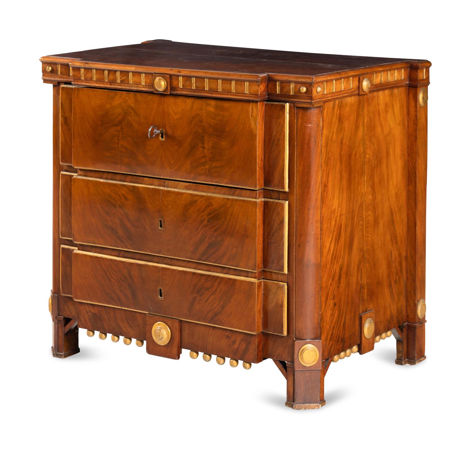 A Baltic Style Parcel Gilt Mahogany Chest of Drawers