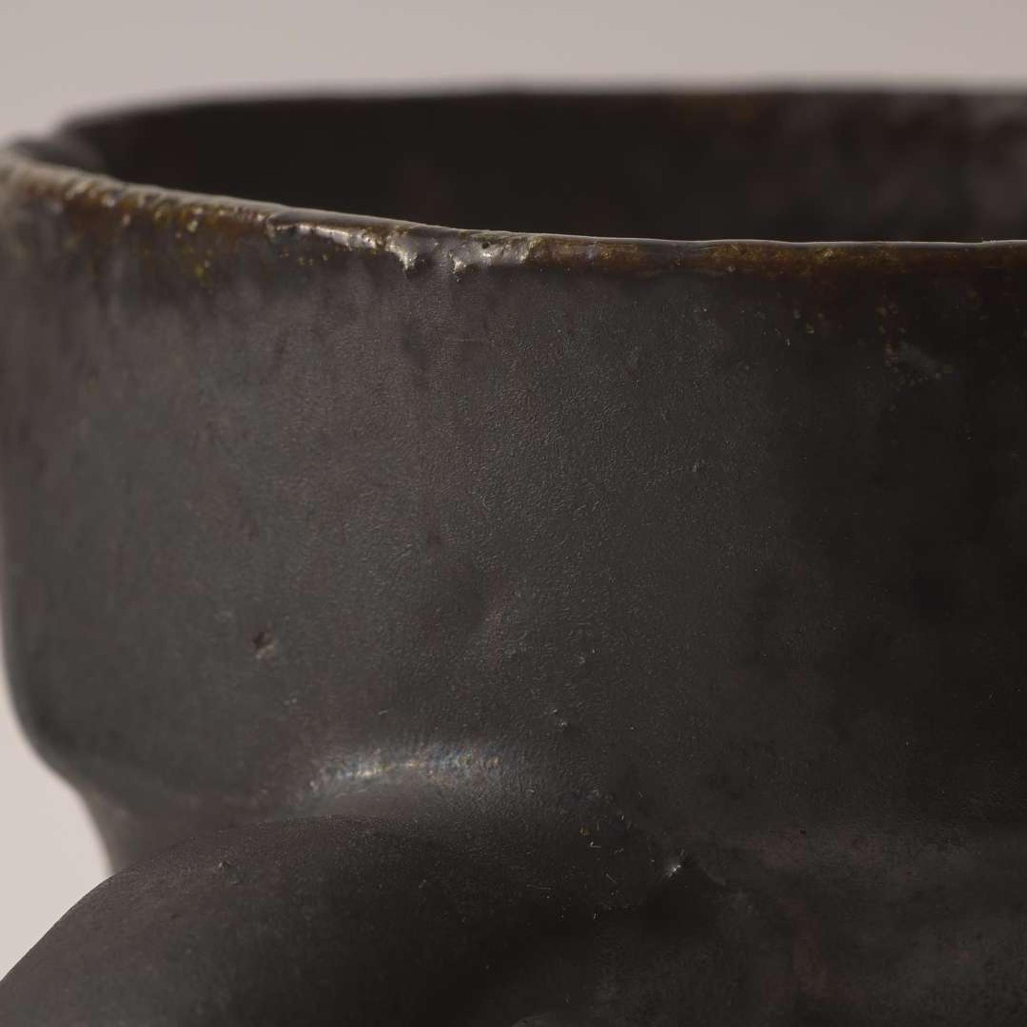 George Ohr (American, 1857-1918) Three-Handled Mug in Matte Gunmetal Glaze with Streaky Olive Interior, Biloxi, Mississippi, USA, circa 1898-1910
