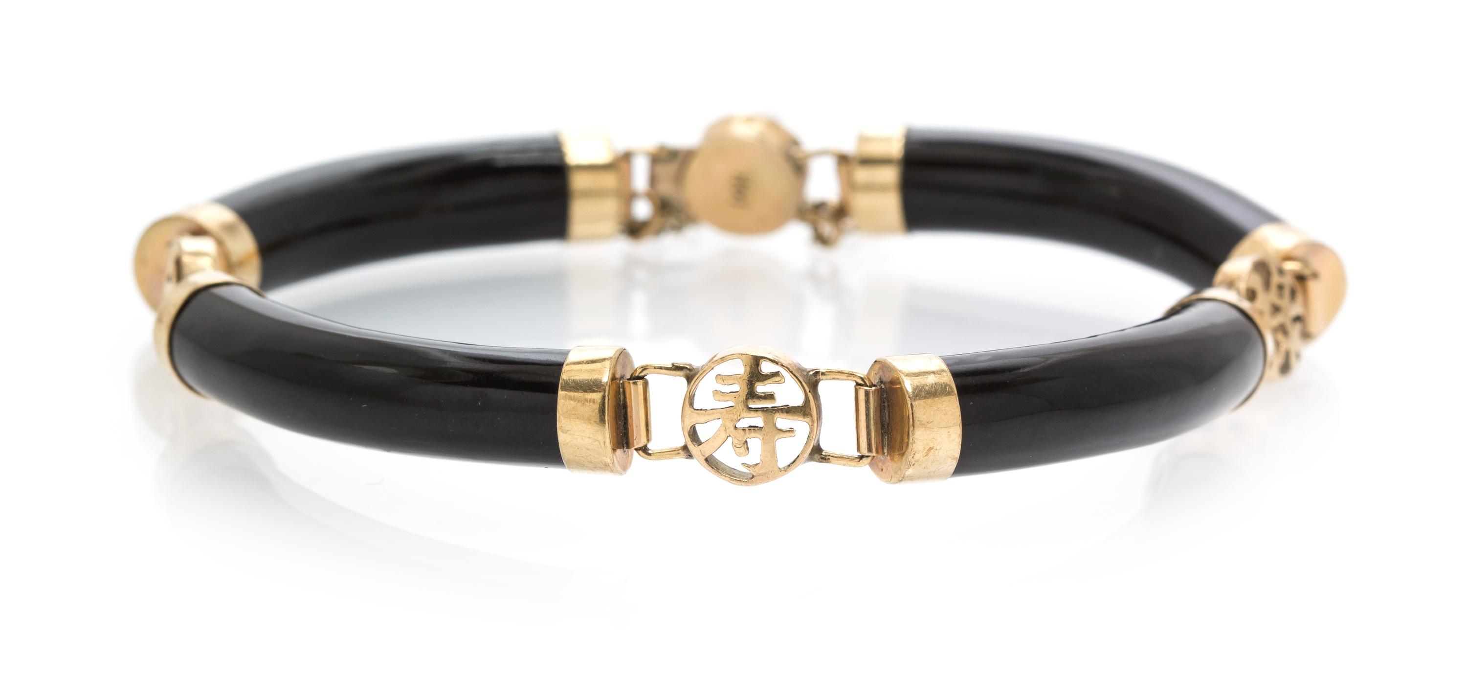 A 14 Karat Yellow Gold and Dyed Onyx Bracelet, 12.10 dwts.