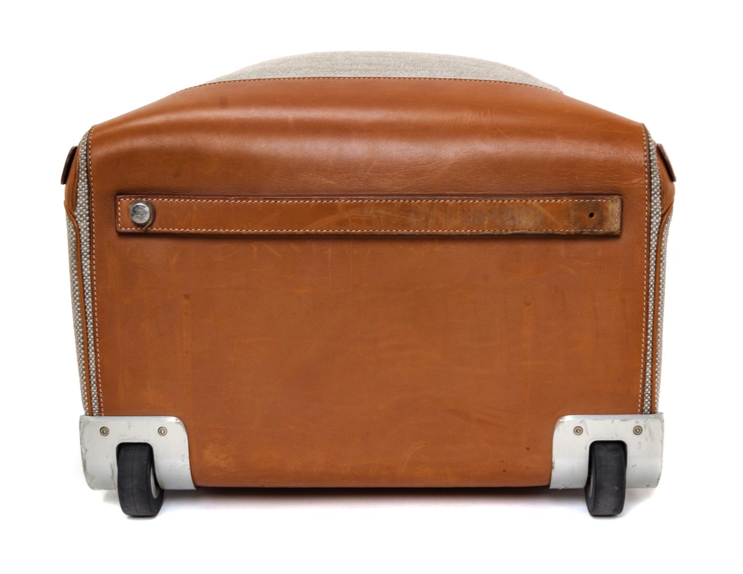 An Hermes Ecru Canvas and Fawn Barenia Calfskin Caleche-Express Suitcase, 14" x 21.5" x 10".