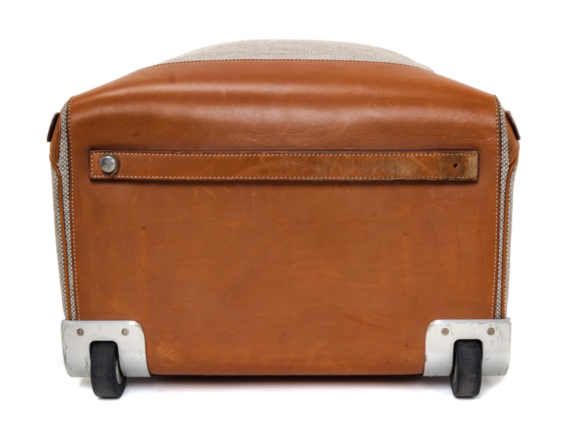 An Hermes Ecru Canvas and Fawn Barenia Calfskin Caleche-Express Suitcase, 14" x 21.5" x 10".