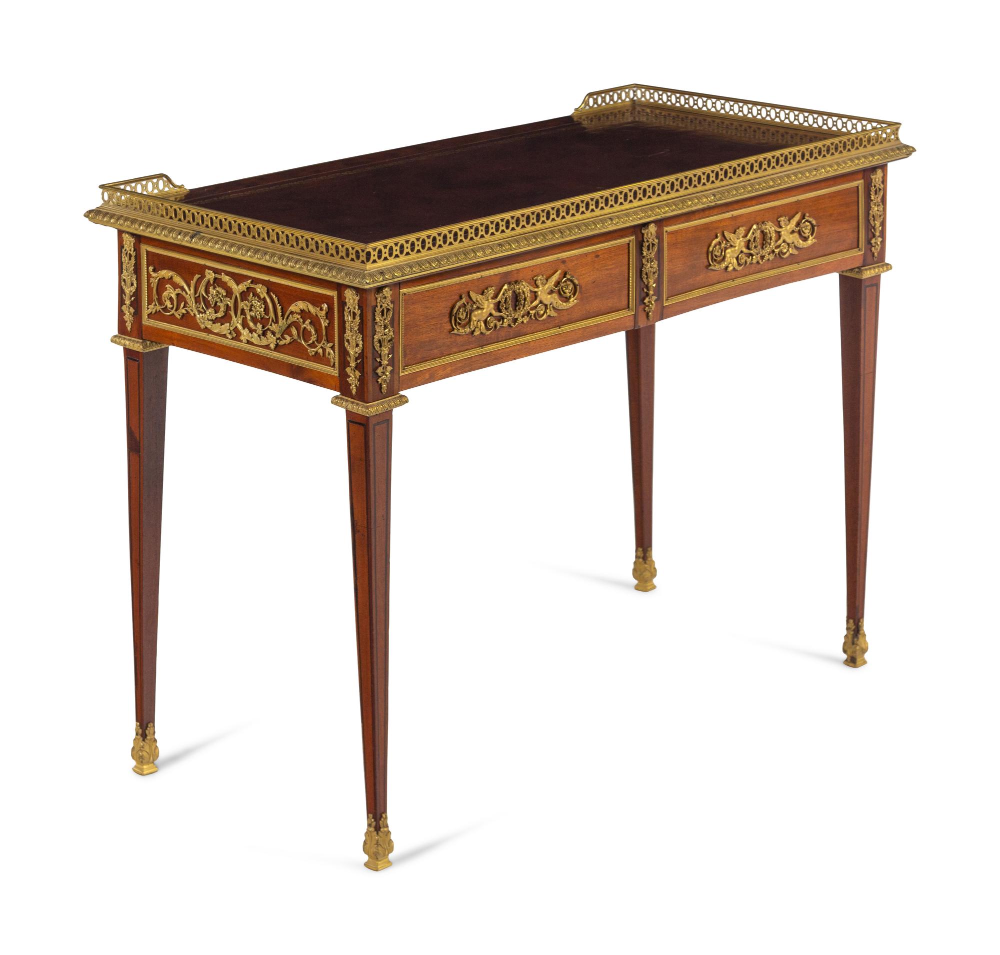 A Louis XVI Style Gilt Bronze Mounted Mahogany Table à Écrire