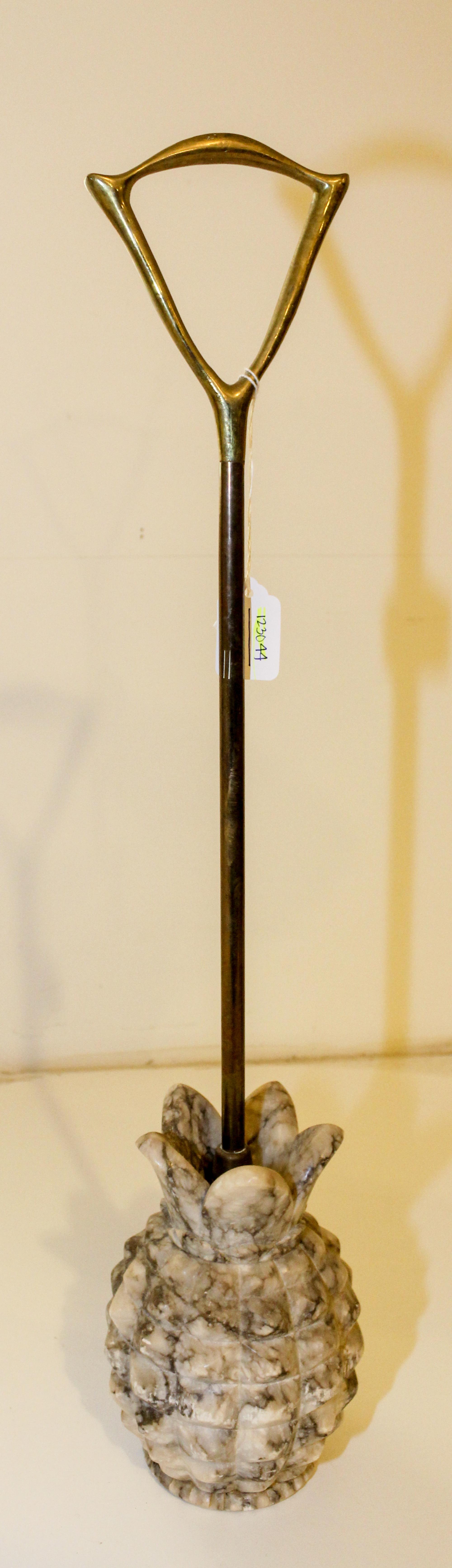 A Gilt Metal and Marble Doorstop Height 24 inches.