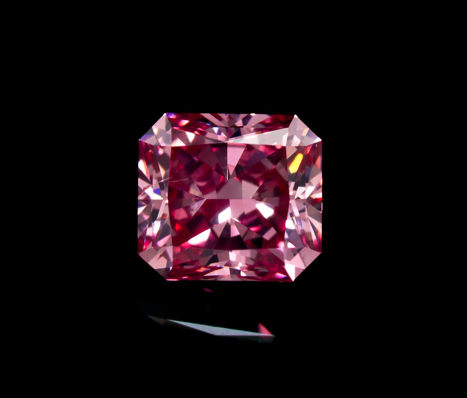 A 0.54 Carat Radiant Cut Fancy Intense Purplish Pink Diamond,