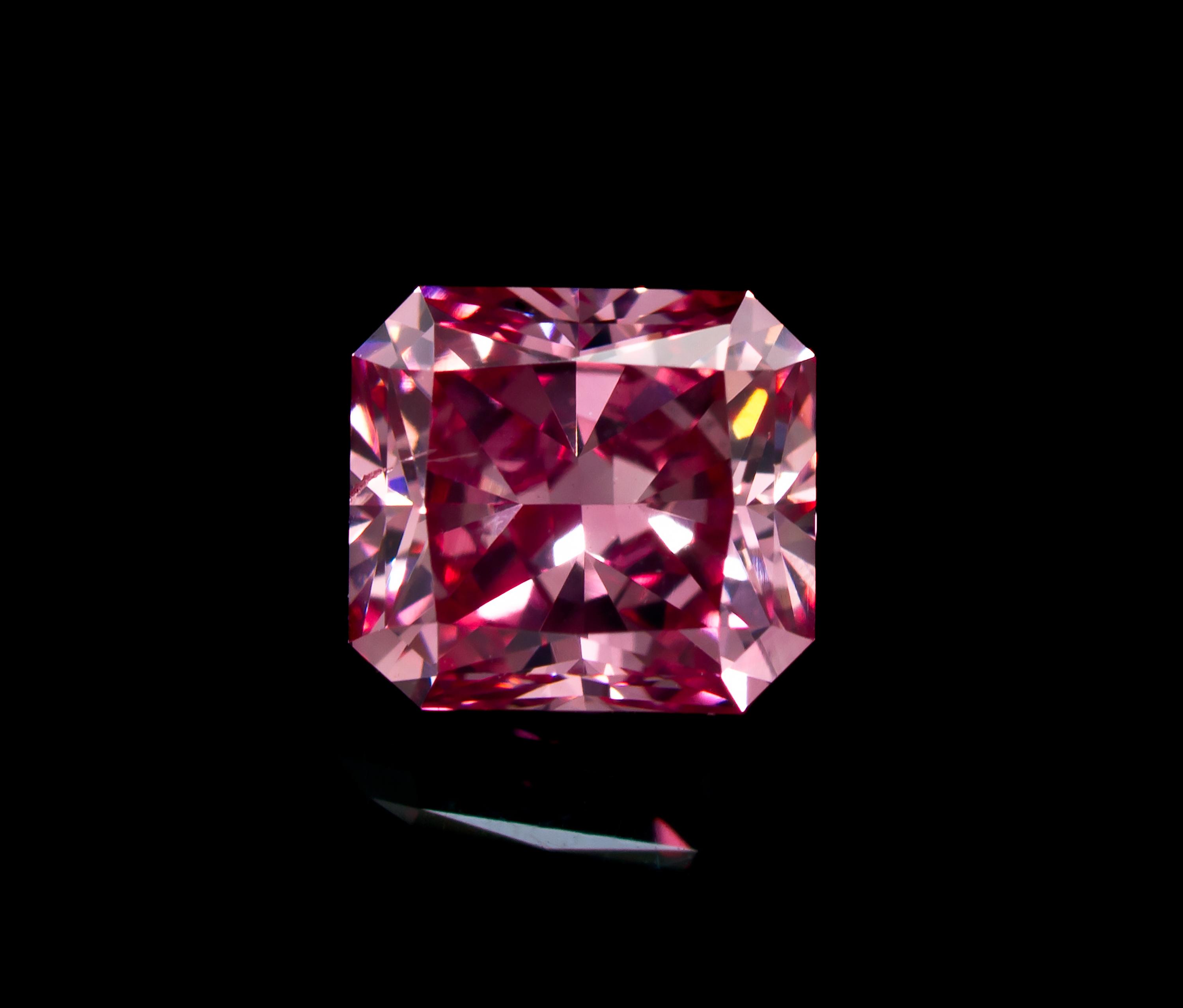A 0.54 Carat Radiant Cut Fancy Intense Purplish Pink Diamond,
