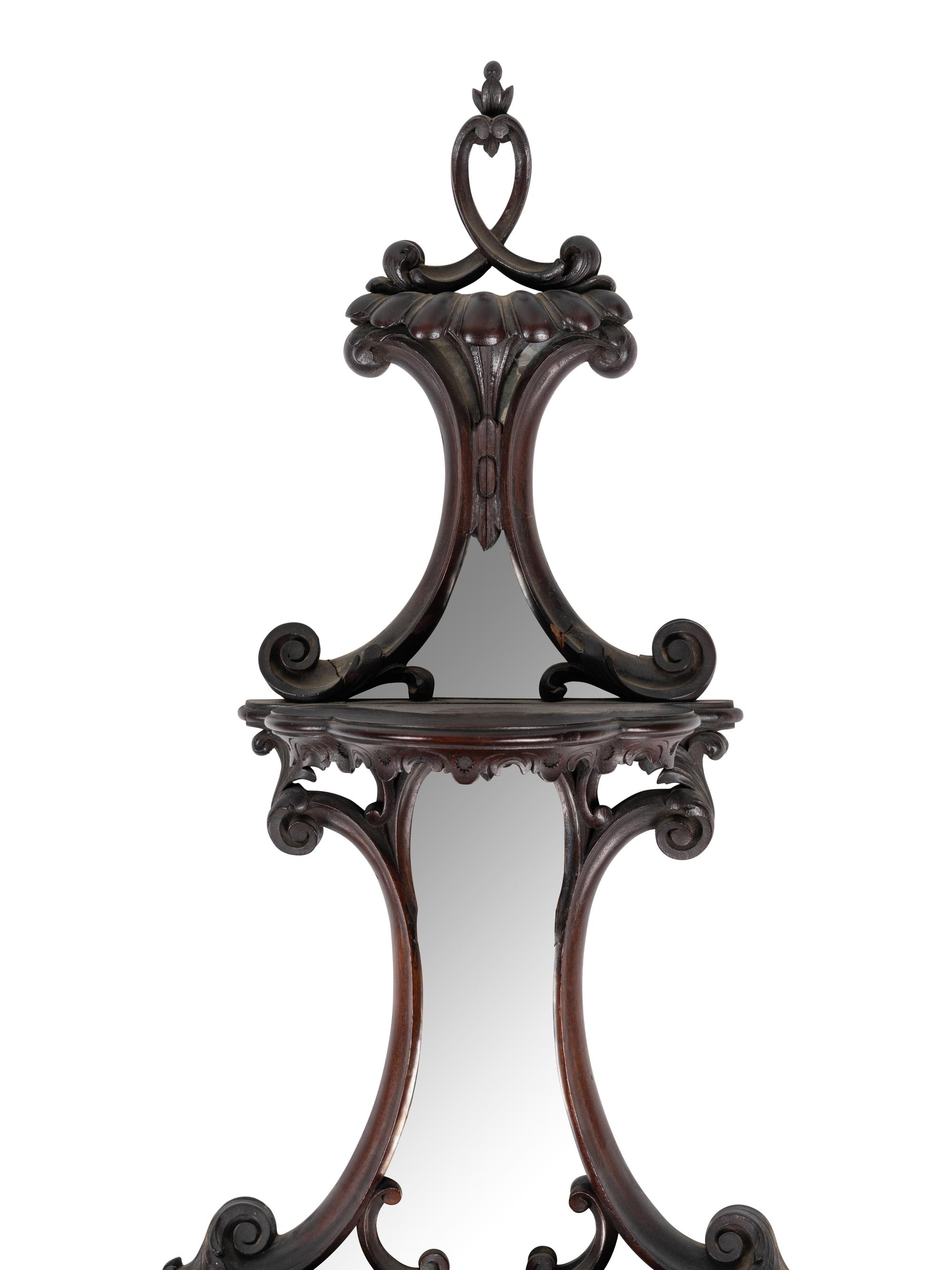 A Pair of George III Style Mirrored and Carved Mahogany Wall Brackets